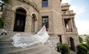 royal length lace veil blowing in the wind