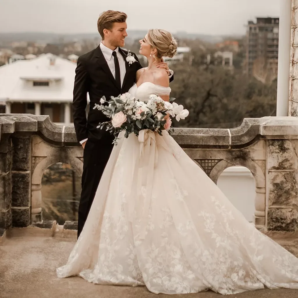 bride-and-groom-austin-blush-wedding-dress bride and groom austin couple blush a-line wedding dress